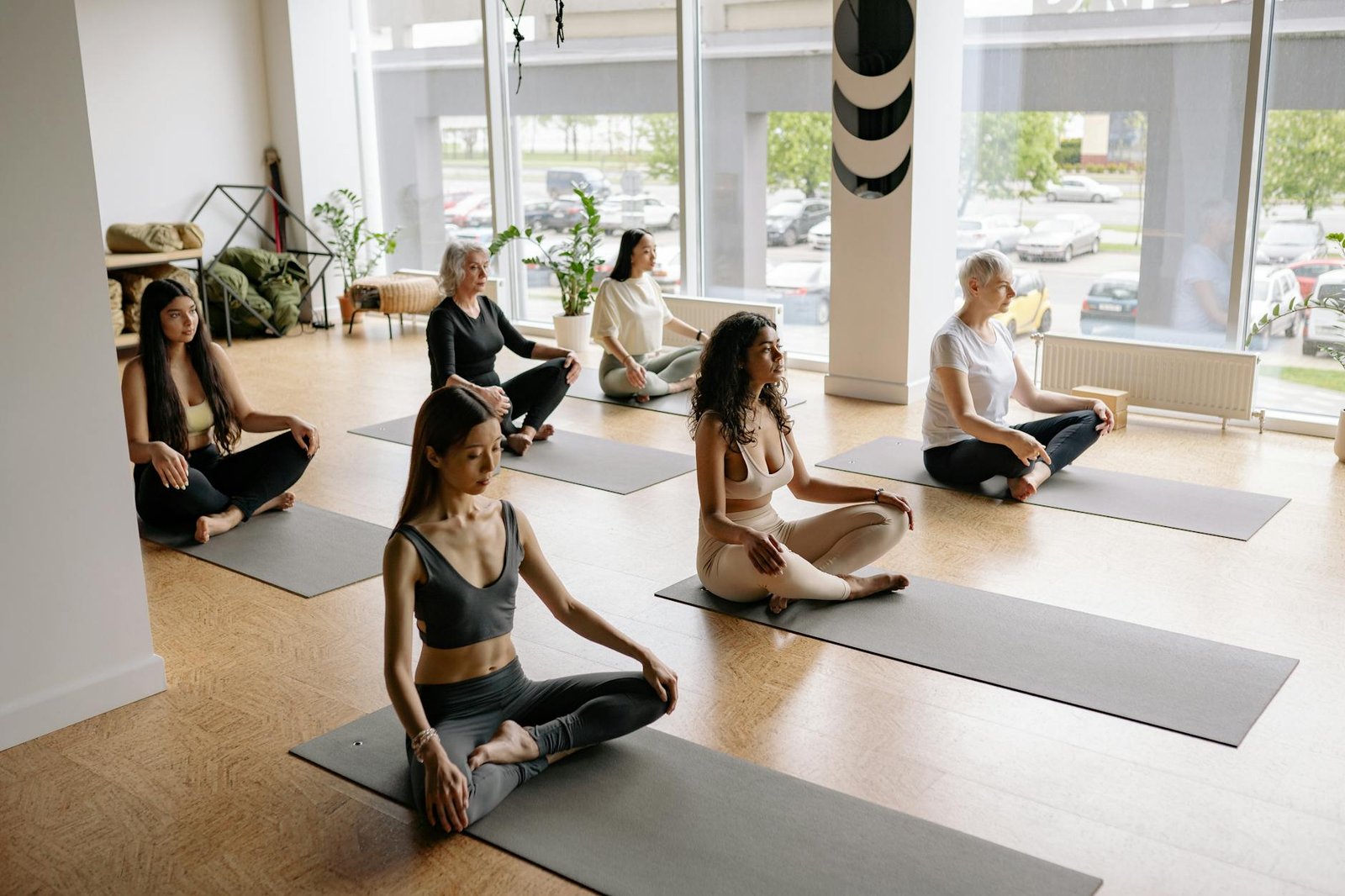 group of women doing yoga exercise